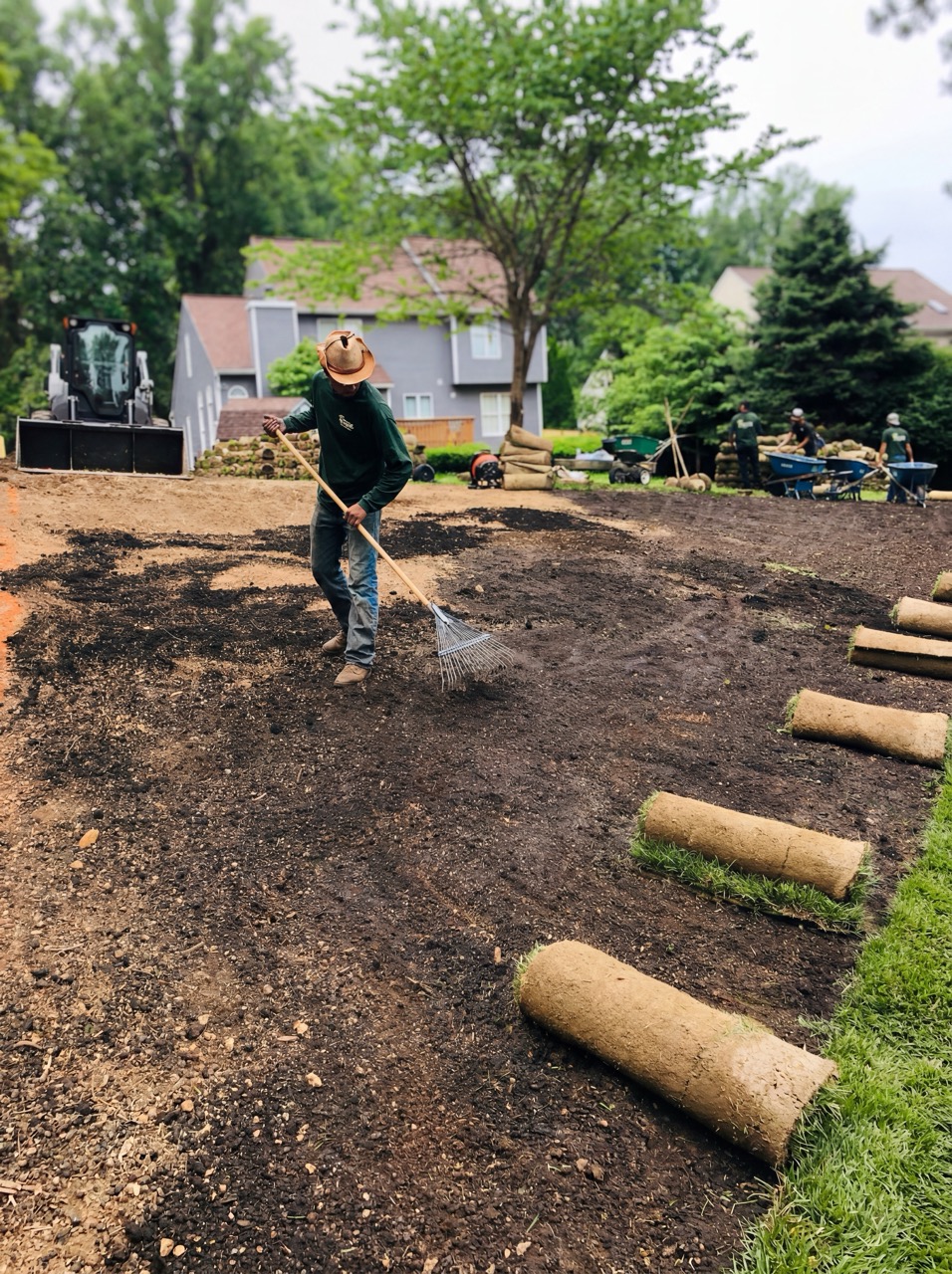Green Life crew installing fresh sod during a lawn renovation in Maryland