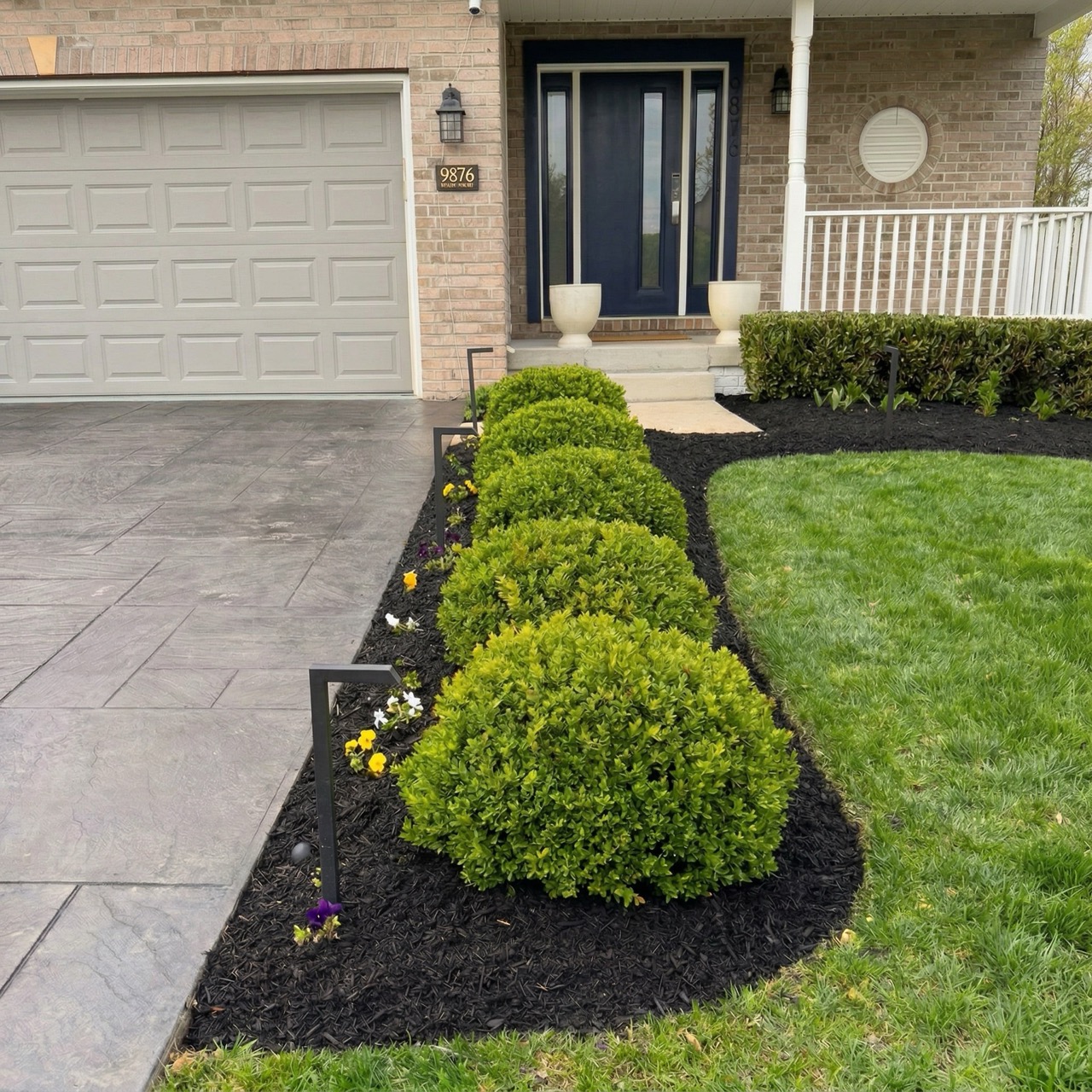 Full-property landscape, mulch, and lawn refresh by Green Life